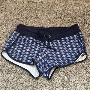 Athleta swim shorts, size Small, navy blue with white pattern.